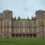a large brown building with lots of windows